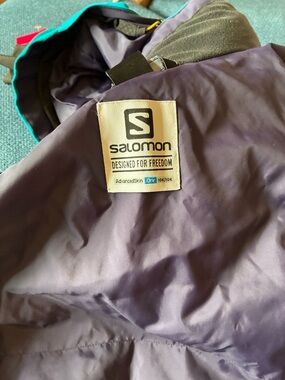 Salomon teal Jacket with Yellow Trim, purple lining